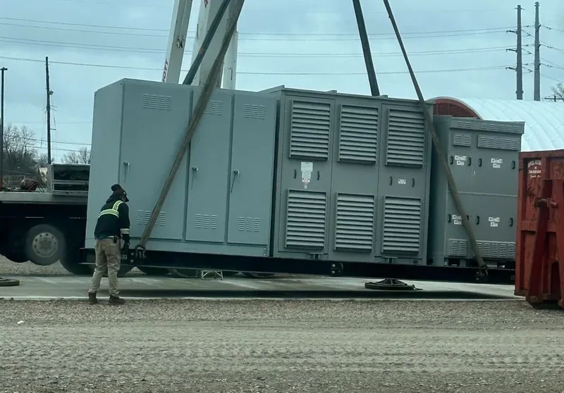 Crane setting a large diesel generator set in place — Canton, OH