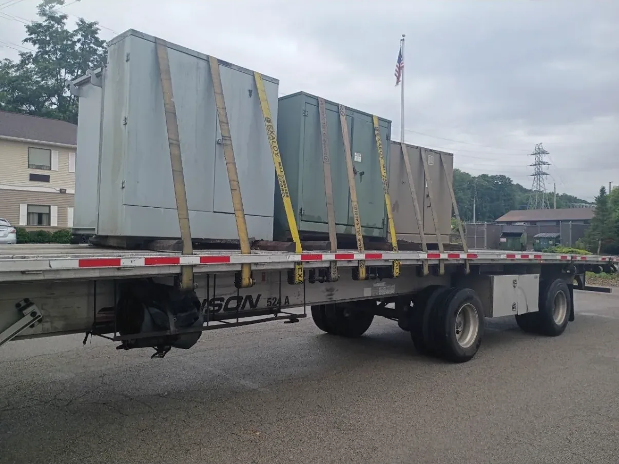 Wrapped and braced switchgear sections on a flatbed — Rockford, IL