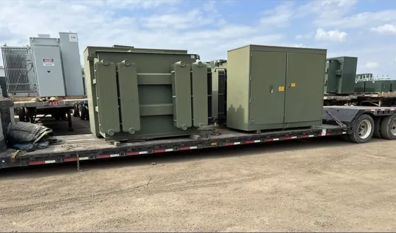 Transformers and enclosures strapped to a flatbed trailer — Canton, OH