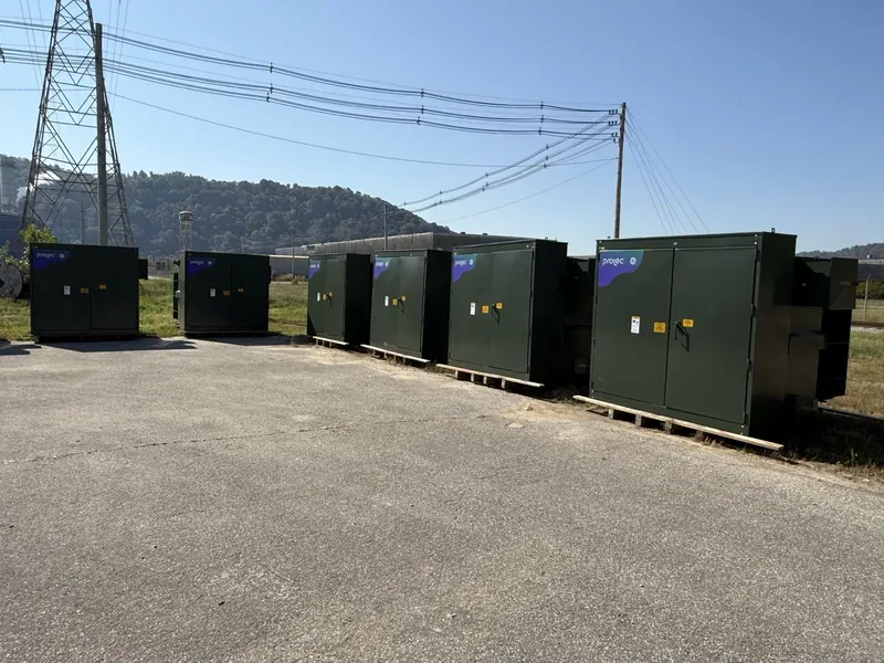 Line of pad-mount transformers under high-voltage transmission lines — Peoria, IL