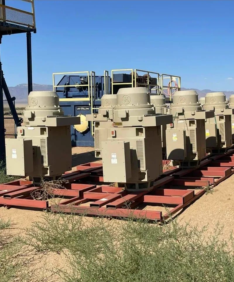 Row of distribution transformers on steel racks in a yard — Youngstown, OH